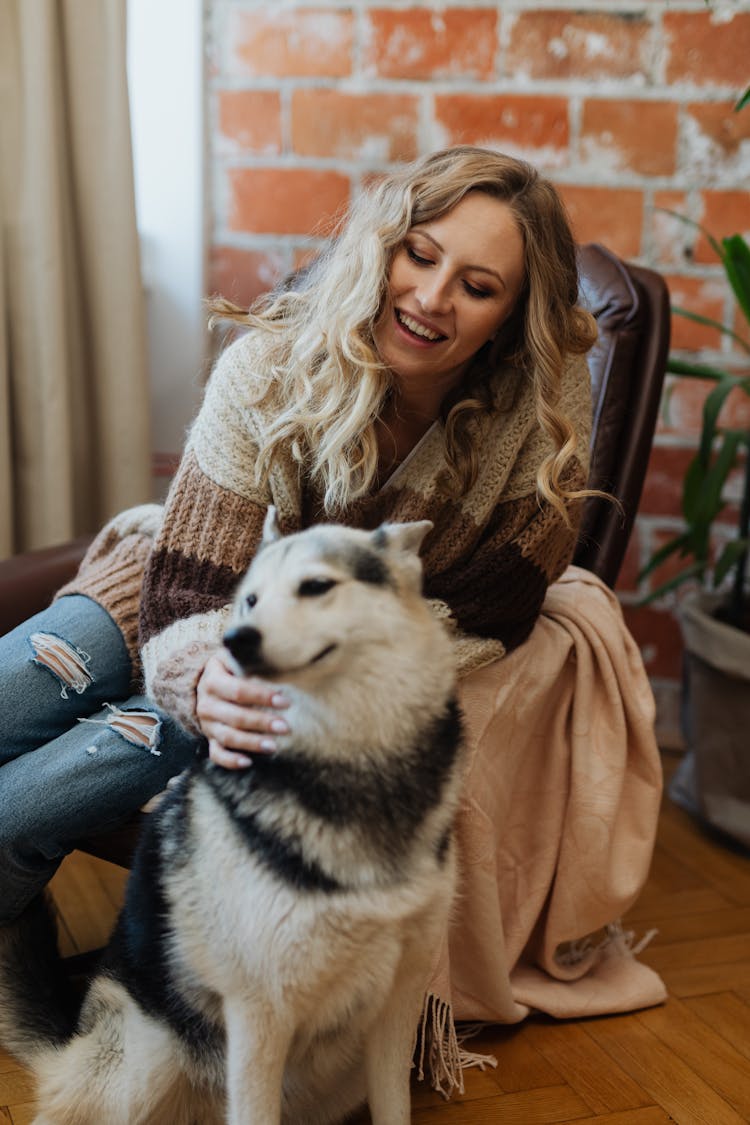 Woman Petting Happy Husky