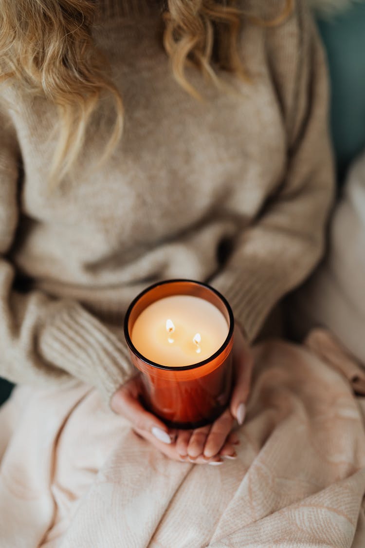 Woman Holding A Burning Candle 