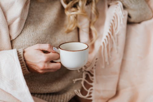 Close Up of Woman Hand Holding Coffee Cup