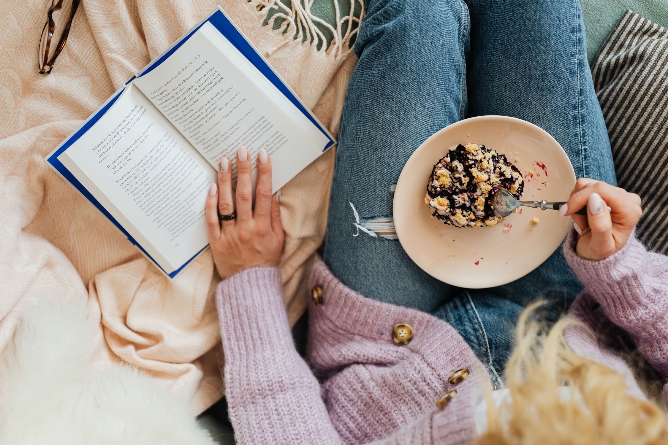 Reading Eating A Person Reading a Book while Having Dessert · Free Stock Photo