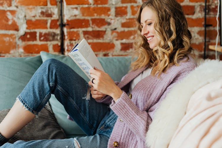 Woman Having Fun Reading A Book