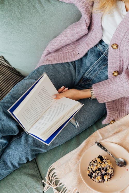 Free Overhead Shot of a Person Holding a Book Stock Photo