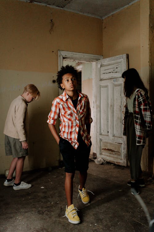 Free Teens Standing Inside the Abandoned Building Stock Photo