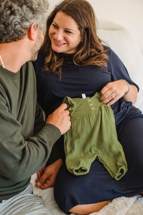 Crop couple considering wear for newborn child
