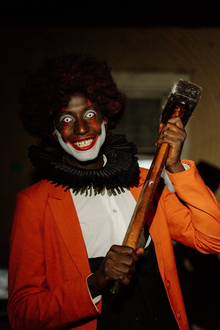 Scary Clown Holding A Hammer