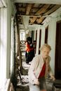 Woman in White Blazer Standing Beside Boy in Red Jacket
