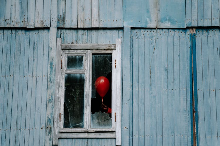 Balloon On A Shattered Window