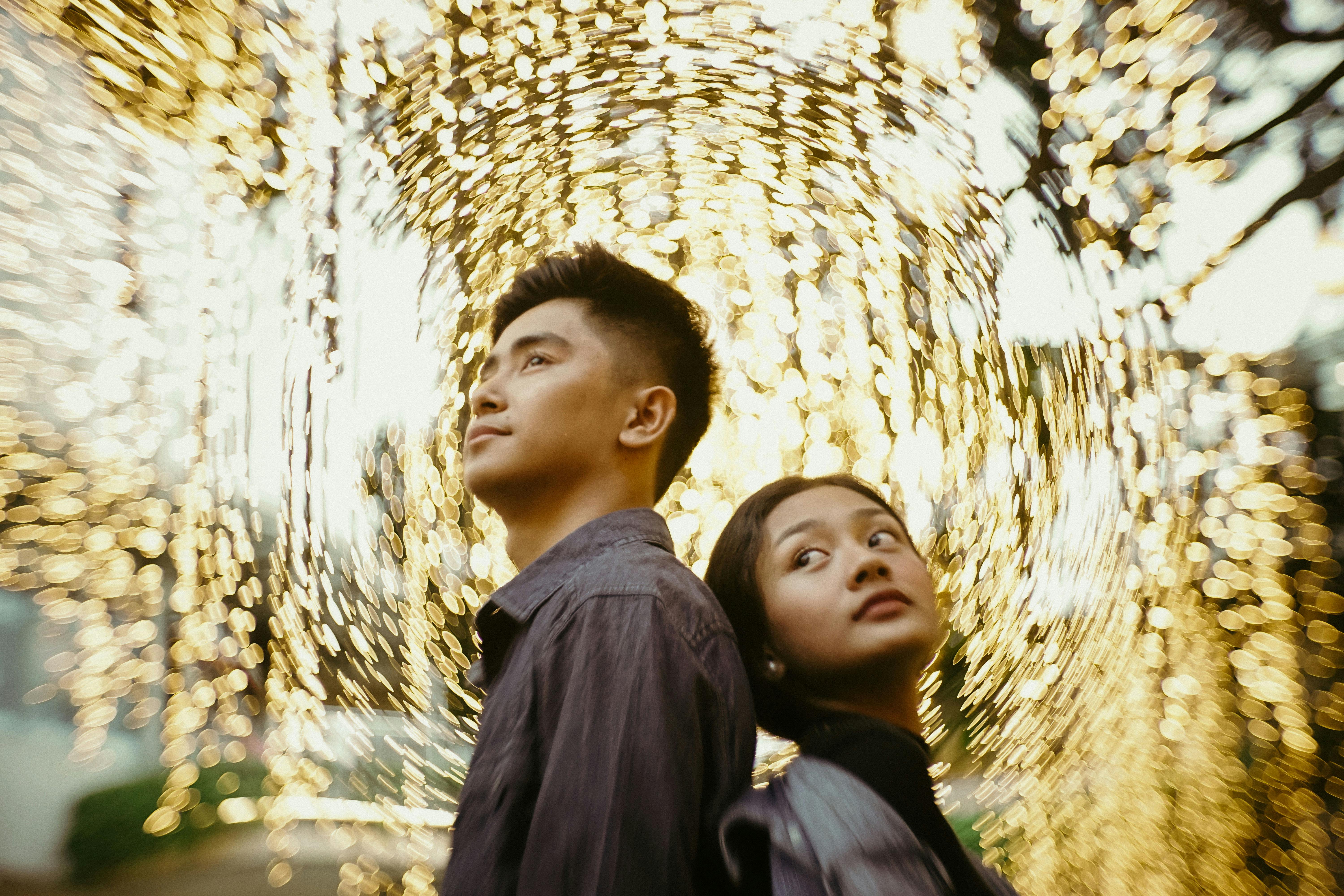 girl and boy standing with swirly bokeh effect