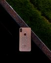 Blue Iphone 5 C on Black Metal Bar