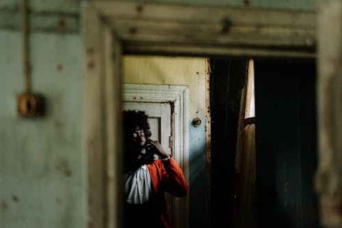 Spooky Clown Smoking inside an Abandoned Building
