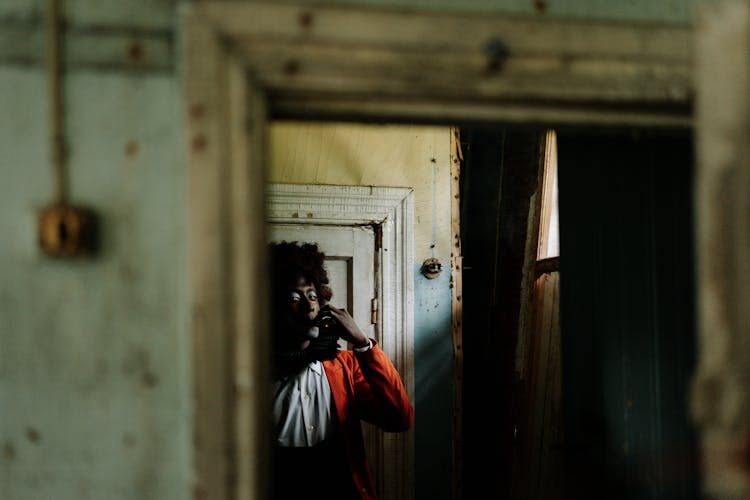 Spooky Clown Smoking Inside An Abandoned Building