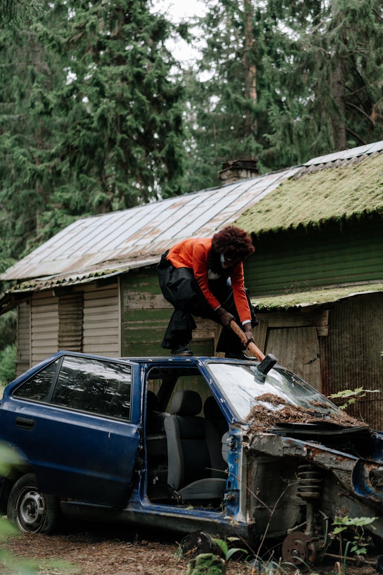 Spooky Clown Smashing A Car Windshield