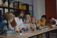 A Teacher Doing Science Experiments with His Students