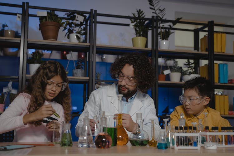  Teacher Doing Science Experiments With His Students