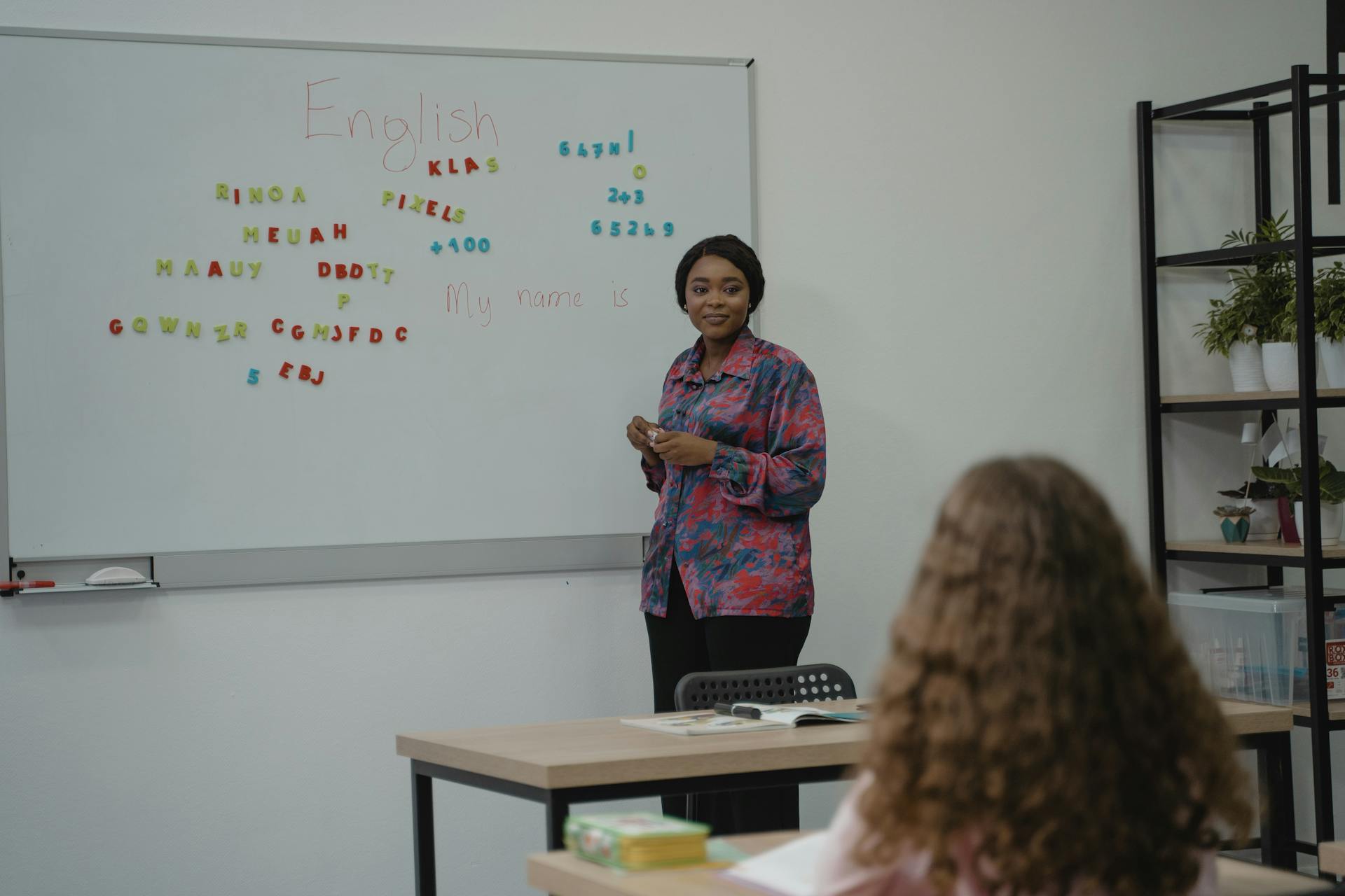 Woman Teaching English in Class