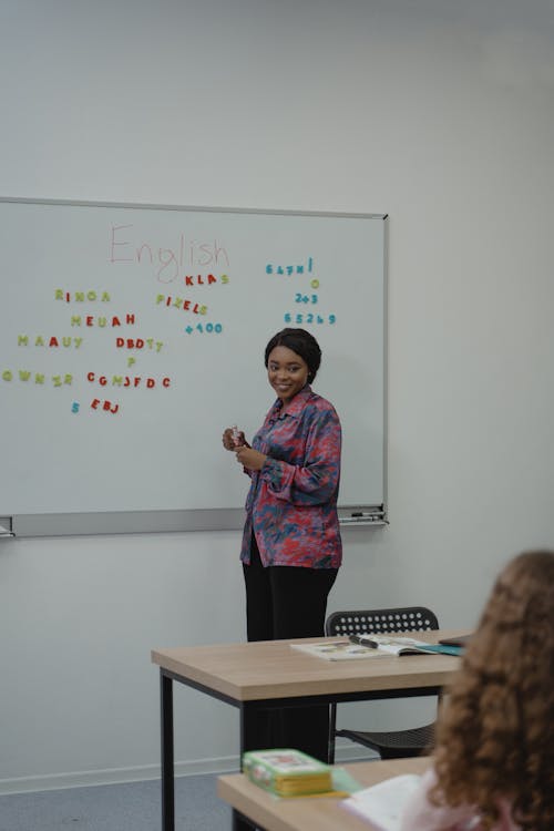 Free Teacher Standing in front of a Class Stock Photo