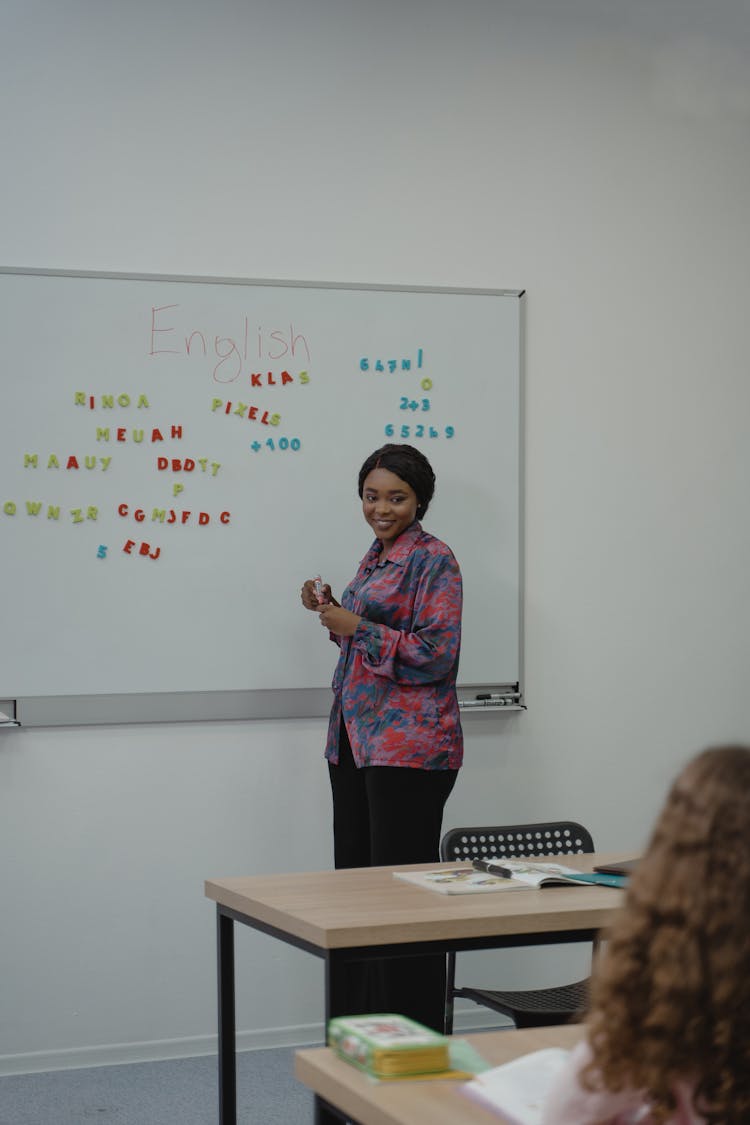 Teacher Standing In Front Of A Class