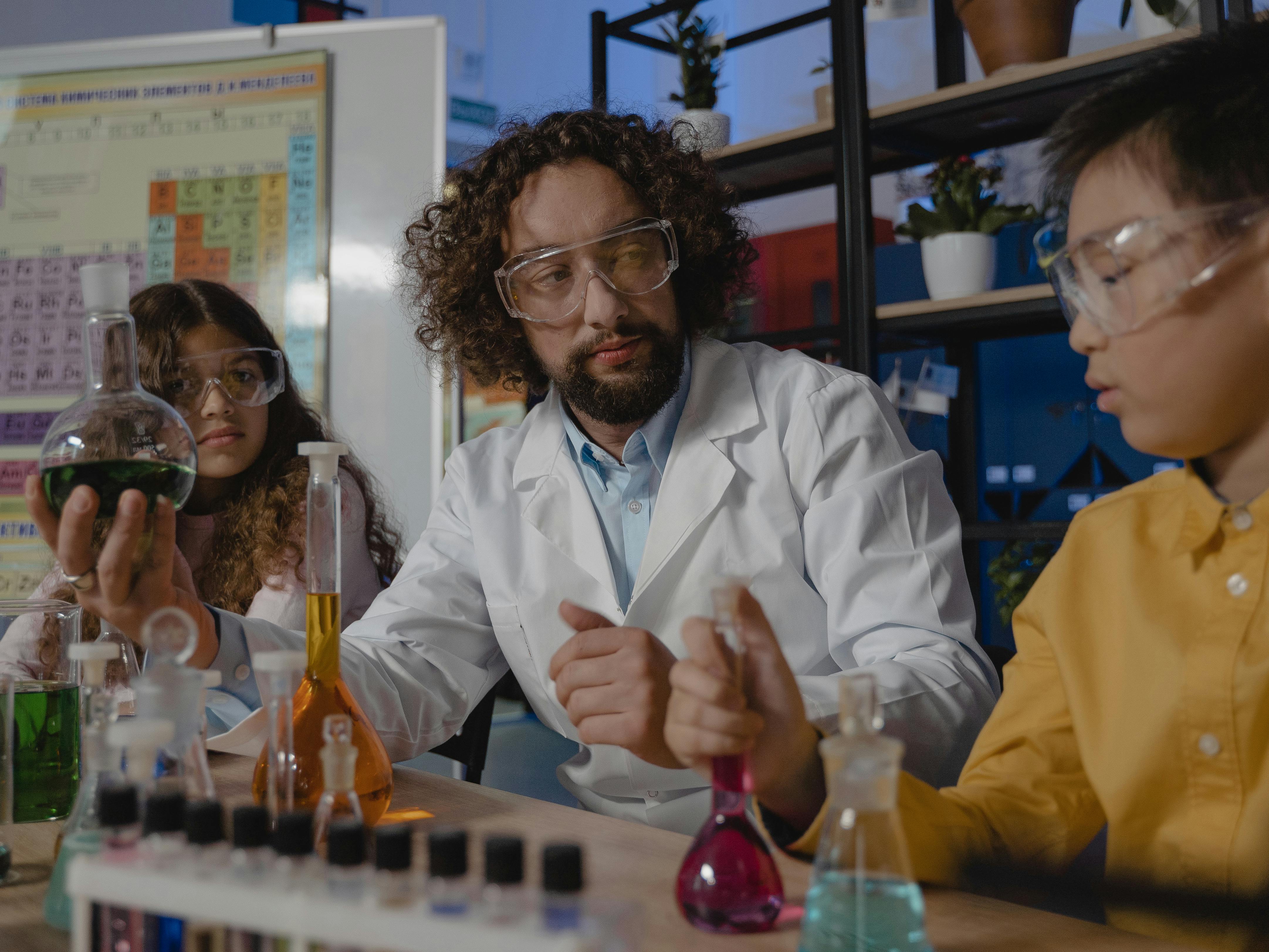 Teacher guiding middle school students during a science film screening