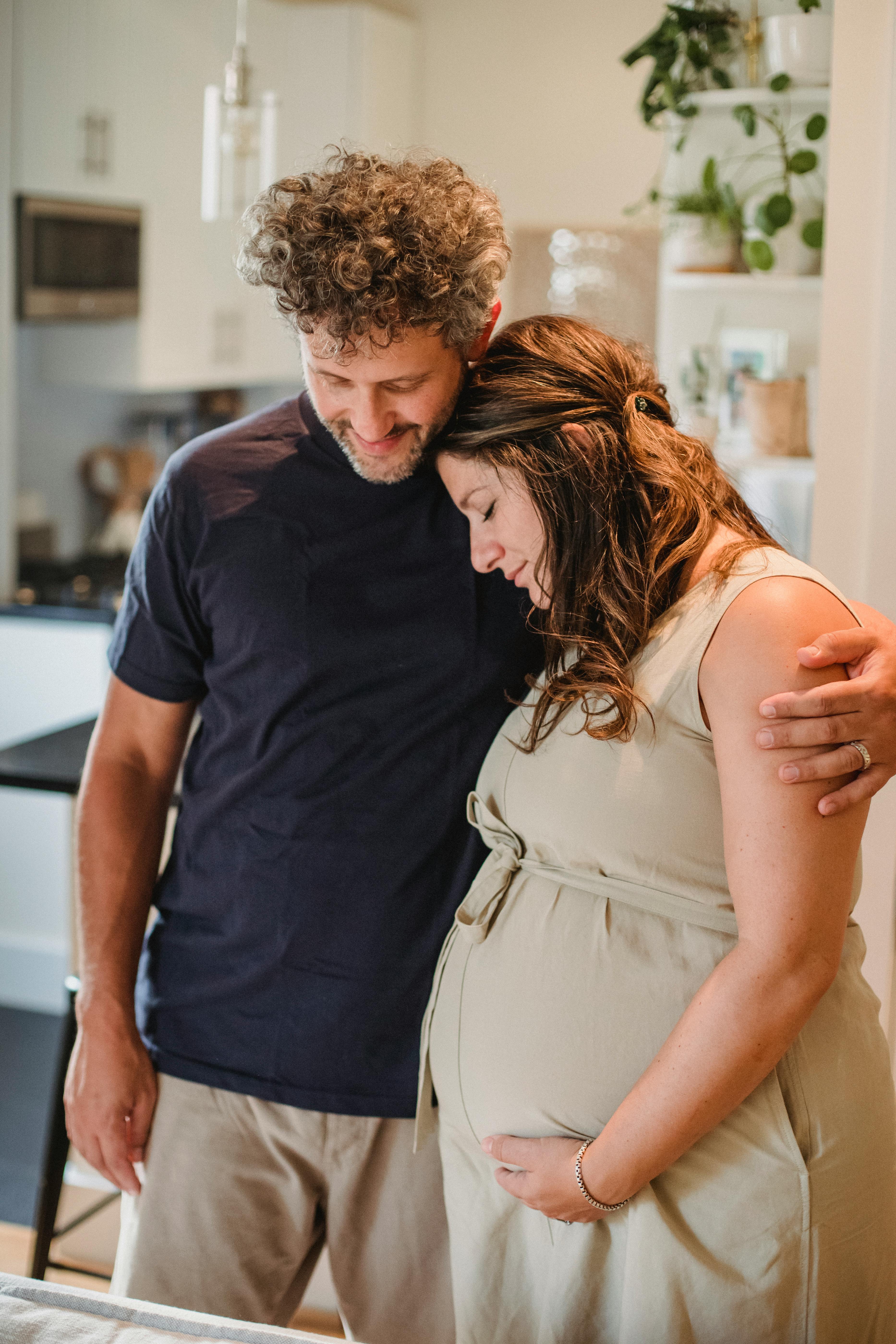 loving couple embracing in apartment