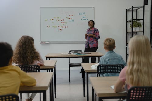 Free Teacher Smiling at Her Students Stock Photo