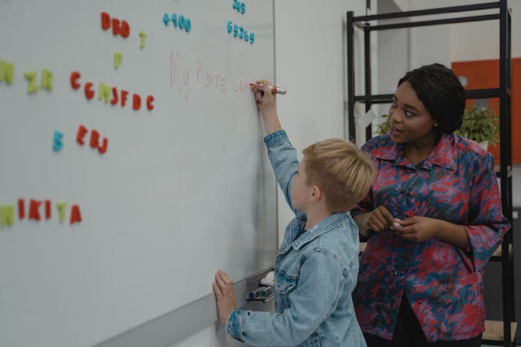 Student Writing On A Whiteboard