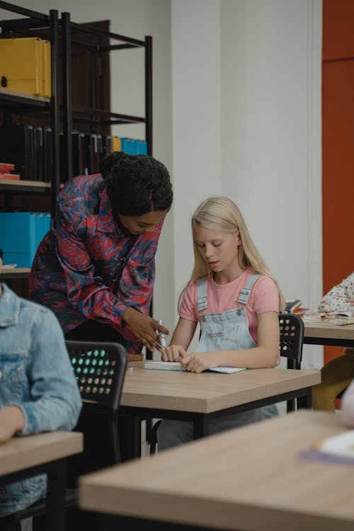 Free Teacher Helping a Student Stock Photo