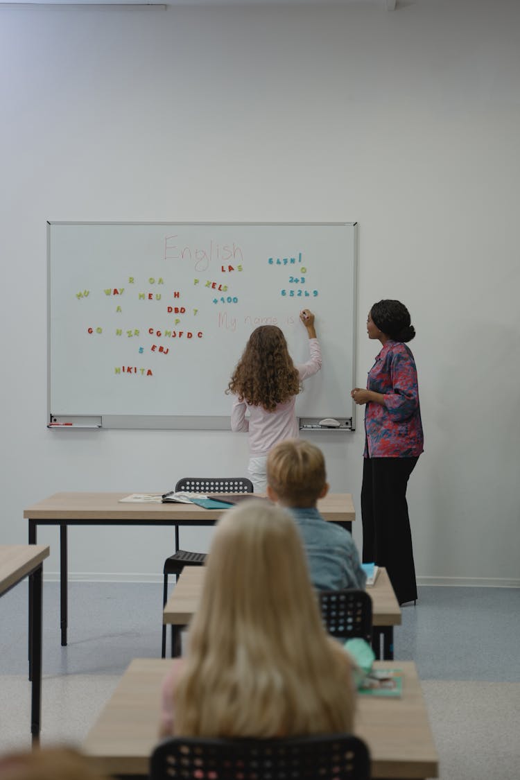 Student Writing On Whiteboard