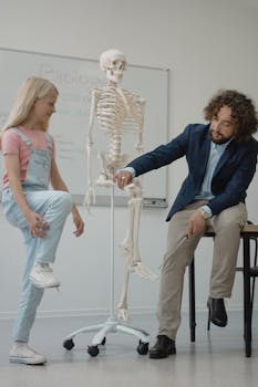 Teacher and student explore human anatomy in an interactive biology lesson.