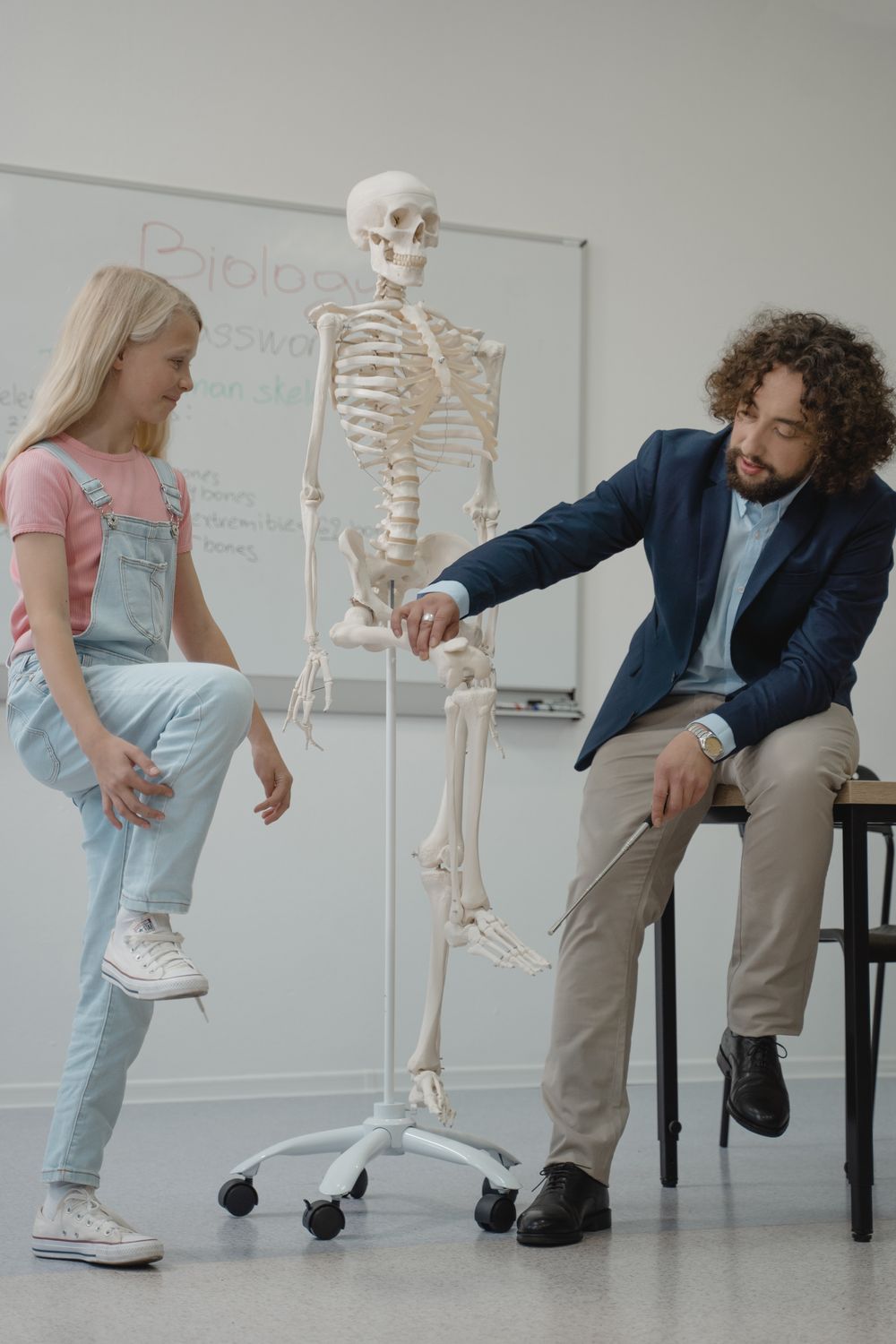 Teacher teaching Biology on a Student · Free Stock Photo