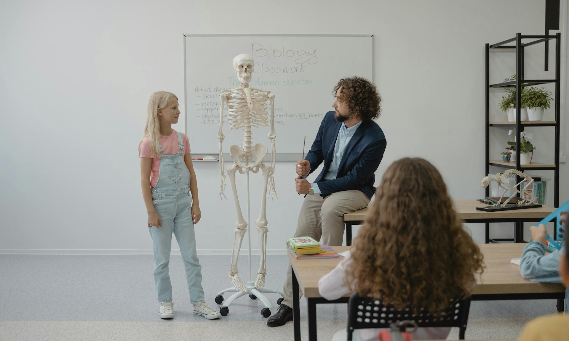 Teacher teaching Biology on a Student