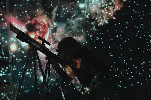 A girl looks through a telescope at a starry projection, blending education with wonder.