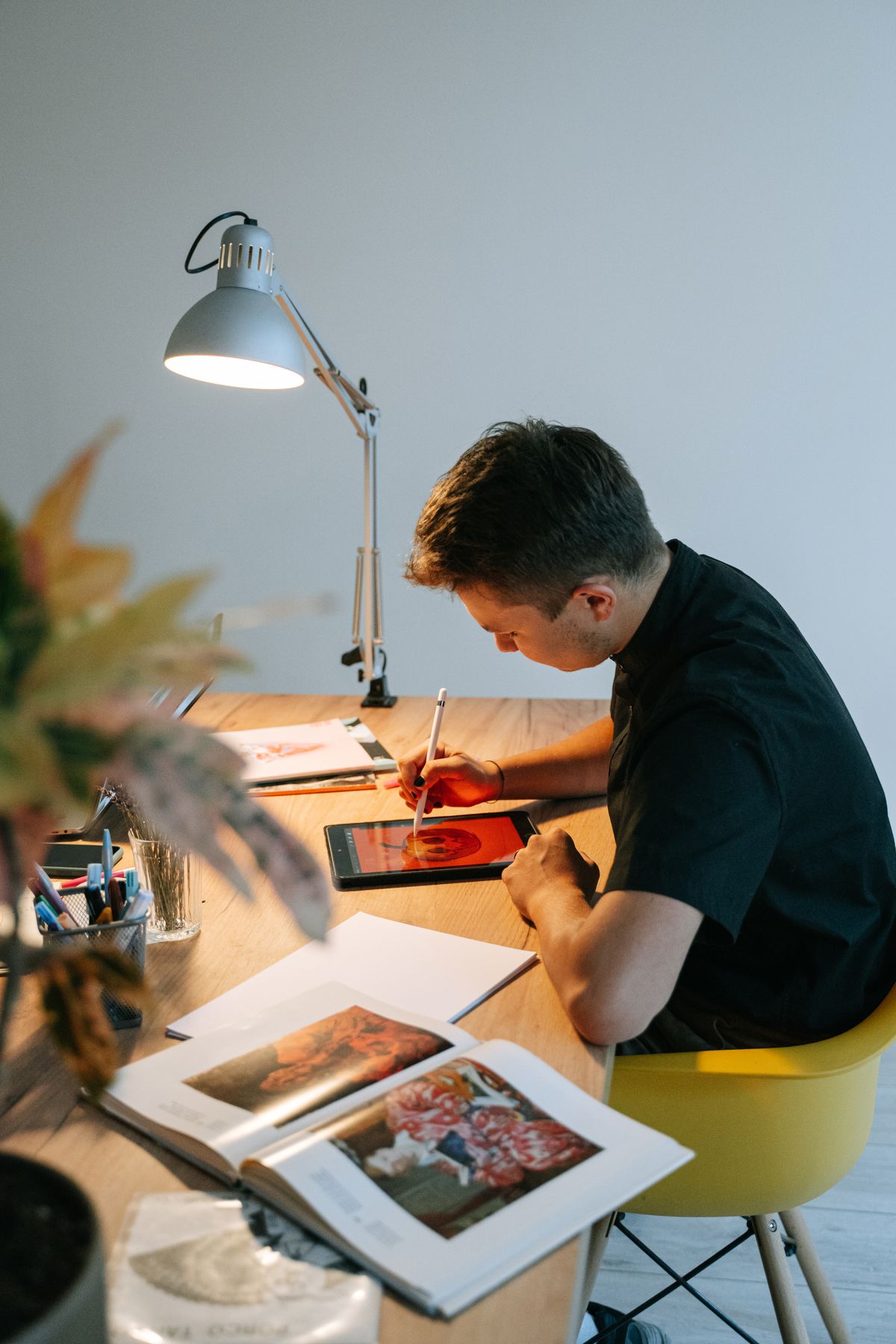 The Atelier Blazer in relaxed tailoring, styled in a bright modern workspace