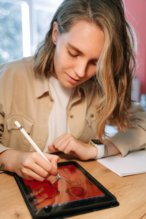 Woman Drawing on a Tablet