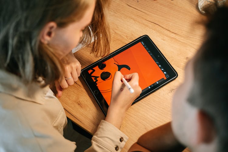 Woman Drawing On A Tablet