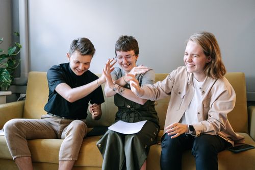 Free Young professionals enjoying a team-building moment indoors. Stock Photo