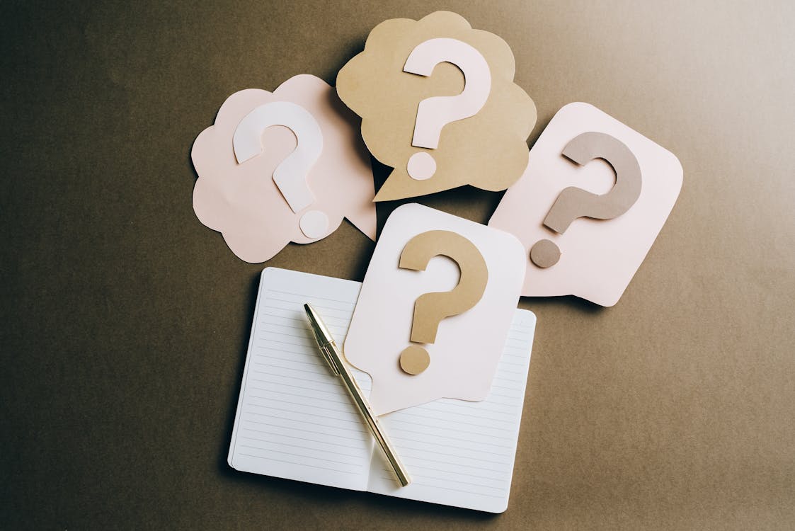 Free Question Marks on Craft Paper Stock Photo
