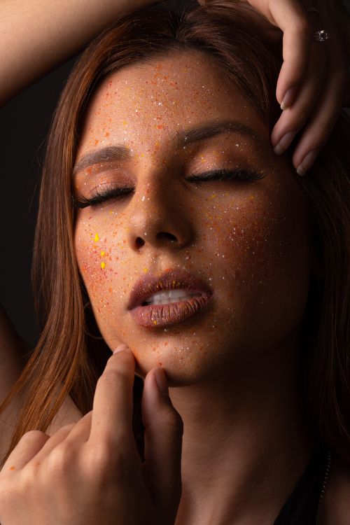 Free Close-up portrait of woman with glitter makeup and closed eyes. Stock Photo