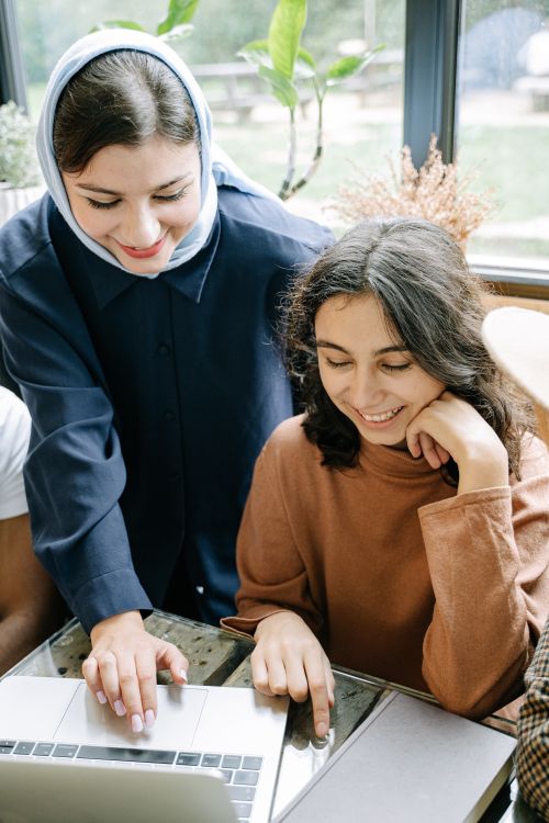 Free Two colleagues collaborating on a project in a contemporary office environment. Stock Photo