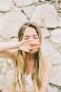 Woman in White Spaghetti Strap With Hand on Her Face