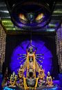 Indian Goddess Figurine Among Mythological Characters in Home Altar