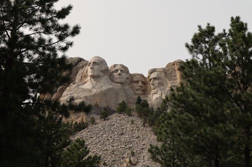 Free Faces of Four USA Presidents Carved in Rocks of Mount Rushmore Stock Photo
