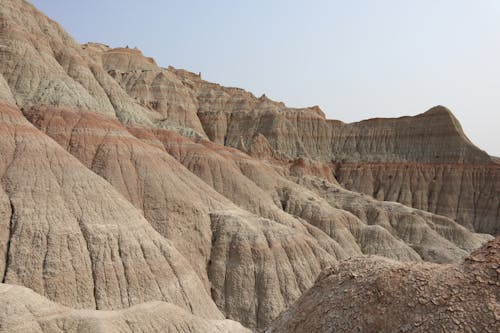 Brown Rock Formations Under Blue Sky