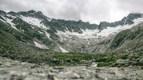 Free Rocky Mountains under Cloudy Skies Stock Photo