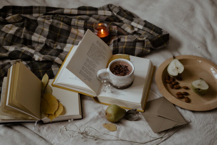 Chocolate Drink On An Opened Book 