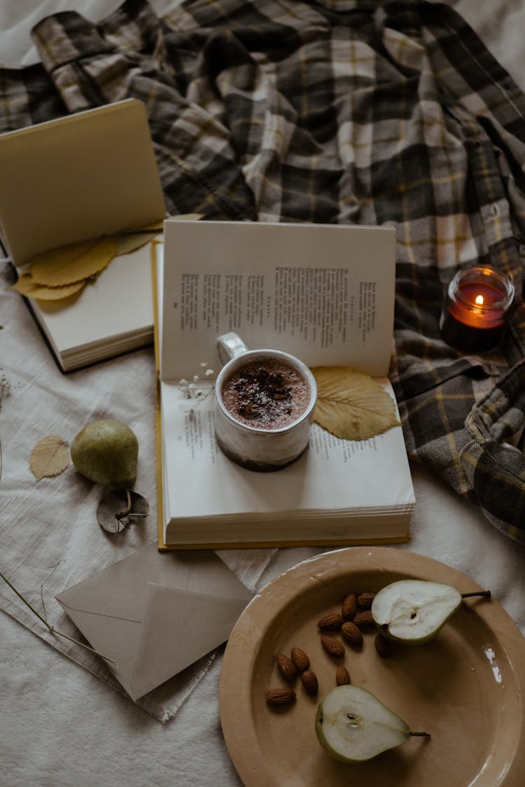 Chocolate Drink On An Opened Book 