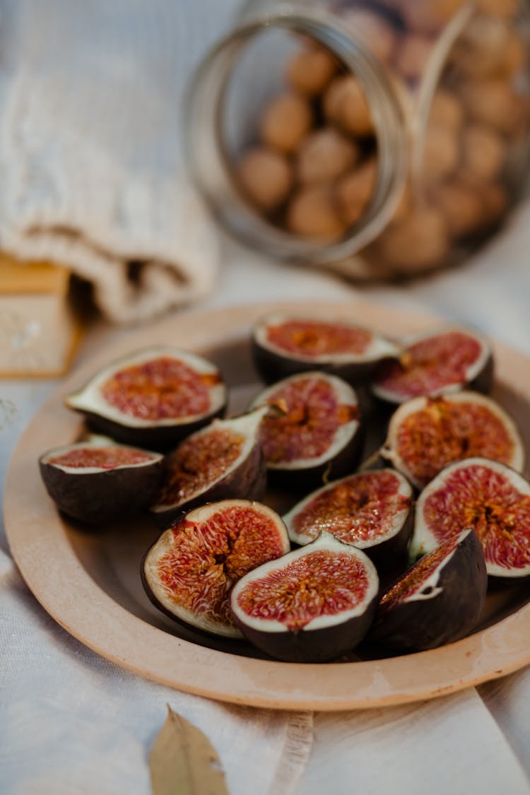 Close-up Photo Of Sliced Figs On A Plate 