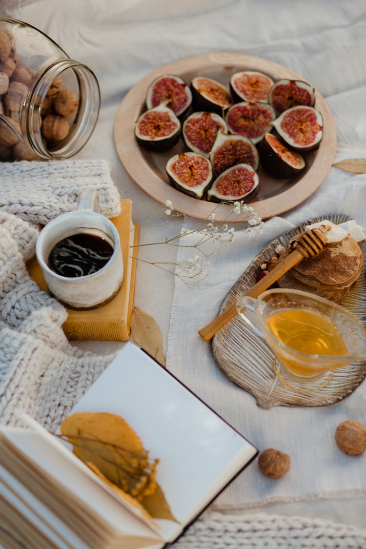 Sliced Figs On White Textile 