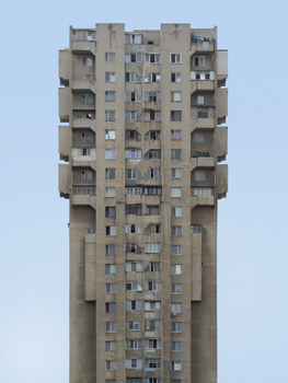 A striking view of a Brutalist high-rise apartment building in Chișinău, capturing its unique architectural style. — photo by Alex Buretz