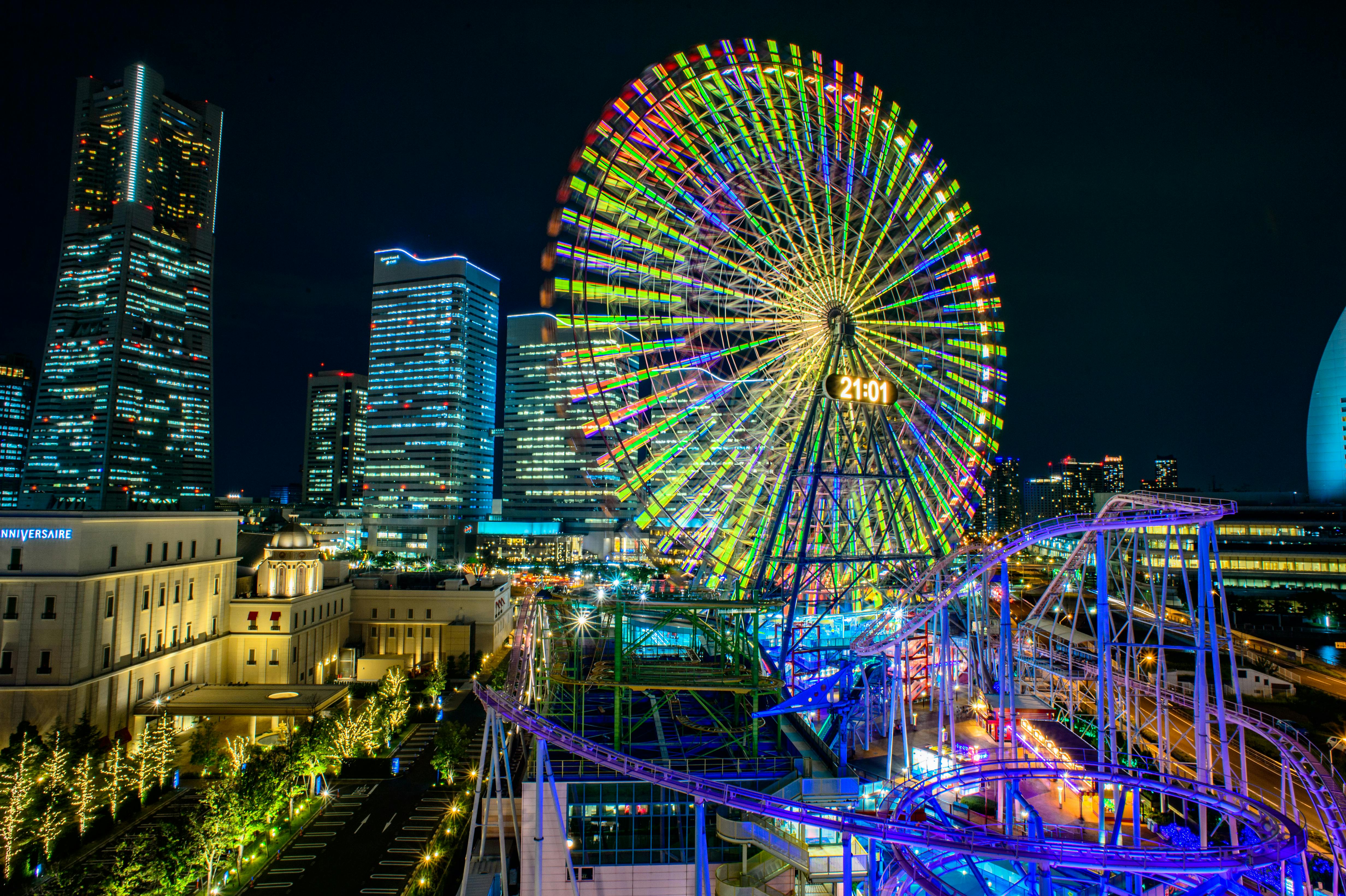 Multicolored Led Lights on Ferris Wheel and Roller Coaster during Nighttime · Free Stock Photo