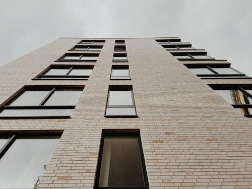 Down View of a White High Rise Concrete Building